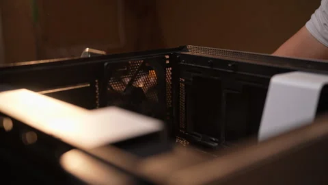 Computer technician cleaning inside desktop computer with vacuum cleaner Stock Footage 289904373