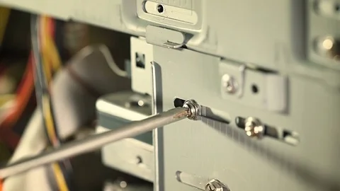 Computer technician is disassembling a personal computer Stock Footage 77768661