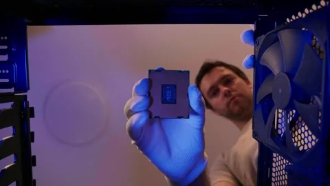 Computer technician installing CPU close up in PC case. Assemble computer system Stock Footage 274816280
