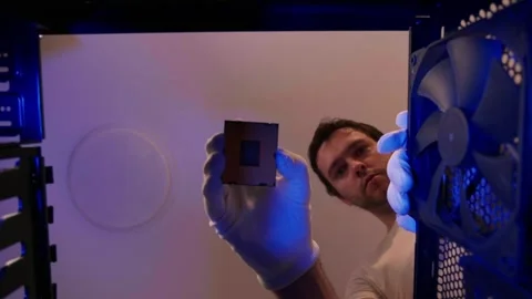 Computer technician installing CPU close up in PC case. Assemble computer system Stock Footage 276916988