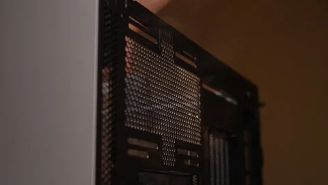 Computer technician meticulously cleaning case with brush, removing dust for Stock Footage 287511716