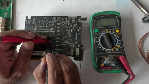 Computer technician is restoring a graphic card Stock Footage 247818519