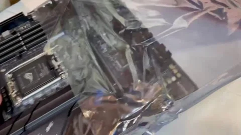 The computer technician takes out a new motherboard from the package Stock Footage 237953638