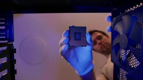 Computer technician uninstalling CPU close up out PC case. Assemble computer Stock Footage 276334120