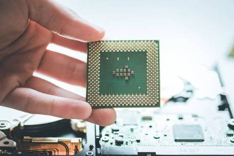 Computer Technology: Close up of male hands holding a cpu Male hand is hol... Stock Photos