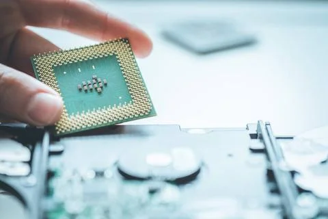 Computer Technology: Close up of male hands holding a cpu Male hand is hol... Foto stock
