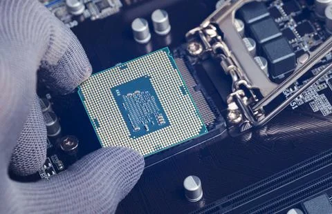 Computer technology hardware concept. Repairman computer Installation CPU. Stock Photos