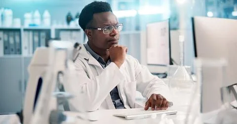 Computer, thinking and black man in laboratory for research, development or Stock Photos