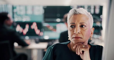 Computer, thinking and trading with mature woman in office for problem solving Stock Footage 303722473