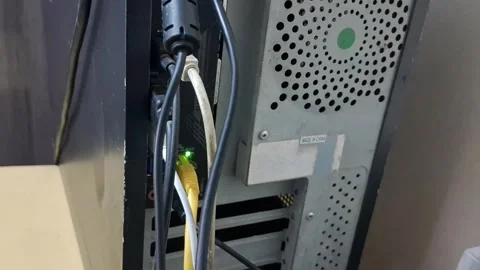 Computer tower back panel showing glowing ethernet connection Stock Footage 345975558