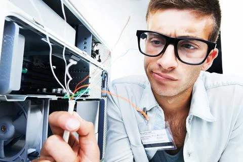 Computer tower, wire problem and man fixing studio hardware, PC equipment or Stock Photos