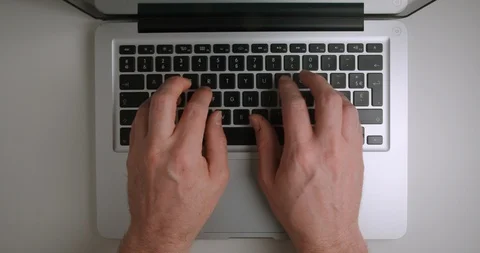 Computer typing from above 4K Видео 127404687