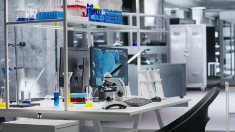 Computer used for molecular results in empty laboratory space 스톡 동영상 318424577