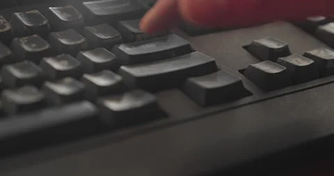 Computer user frantically hitting enter key on keyboard low angle 4K Stock Footage 332634605