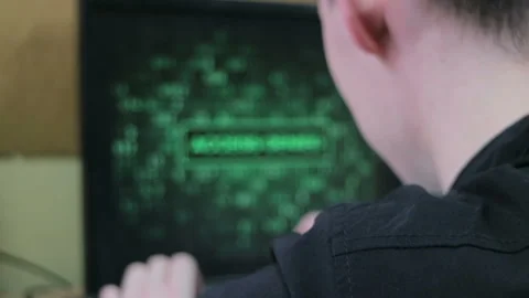 The computer user tries to remember the password. Handheld shot. Cinematic look Stock Footage 85645132