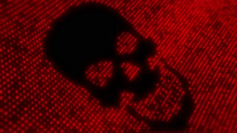 Computer virus code on a screen with a skull malware attack Stock Footage 157758356
