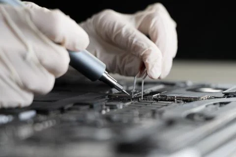 A computer warranty guarantee, hands work with computer components Stock Photos