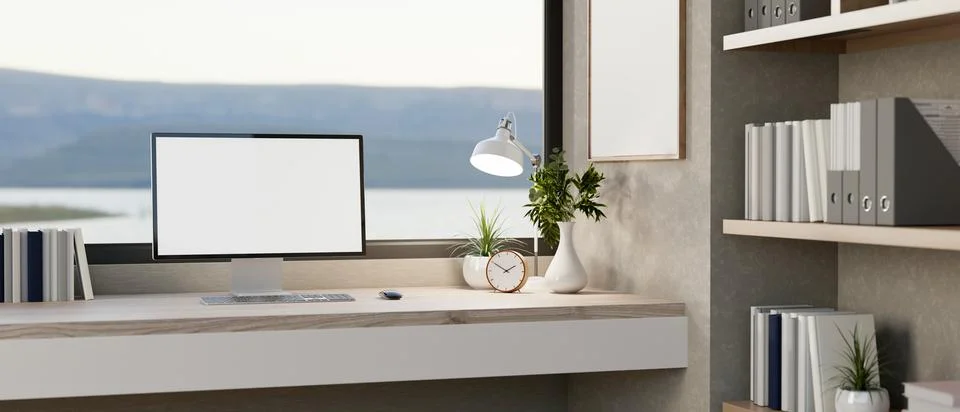 A computer with a white screen mockup and decor placed on a desk against a .. イラスト素材