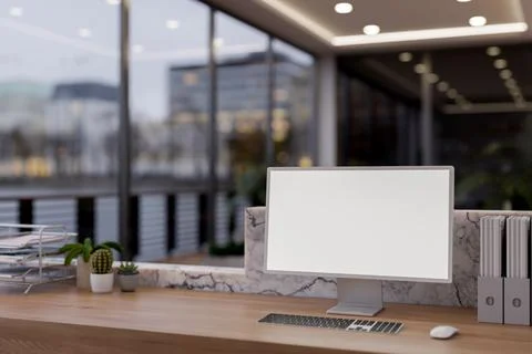 A computer with a white screen mockup sits on a reception counter in a mode.. イラスト素材