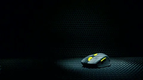 Computer wireless mouse on a dark textured background Stock Footage 240652804