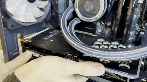 Computer wizard inserting video card into motherboard Stock Footage 237953639