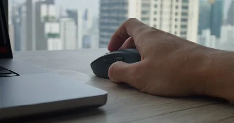 Computer work persons hand maneuvers computer mouse with ease seamlessly Stock Footage 312508956