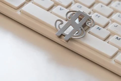 Computer working keyboard with american dollar close-up. The concept of onlin Stock Photos