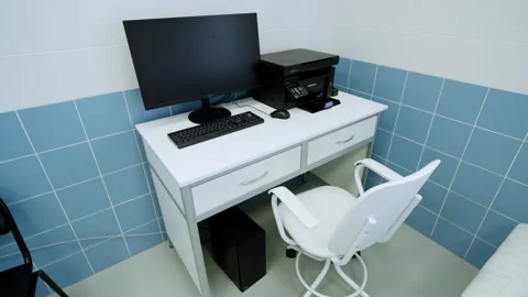 Computer workstation sits on desk equipped with printer Stock Footage 337720641
