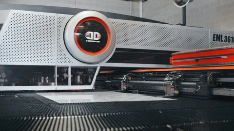 Computerized automatic cnc machine cutting sheet metal blanks in factory Stock Footage 125965657