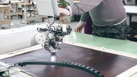 Computerized Automatic Quilting Machine operator man sets the program Video stock 88449929