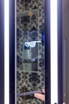 Computerized centering system for precise measurement of ophthalmic lenses Stock Photos