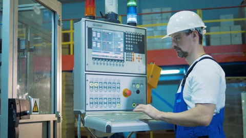 Computerized control device is being managed by a male technician Stock Footage 105645363