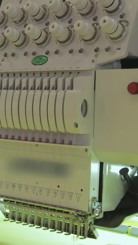 Computerized Embroidery Machine Brings Fabric Designs to Vibrant Life Stock Footage 341068574