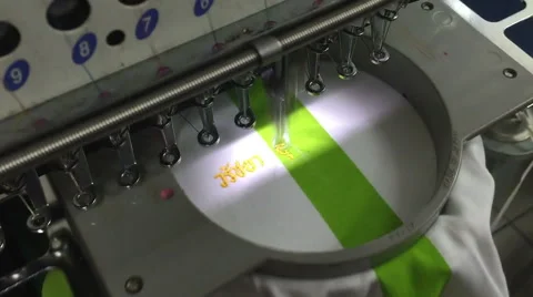 Computerized embroidery machine, working on lacing Thai text on T-shirt 스톡 동영상 47380274