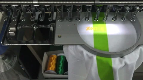 Computerized embroidery machine, working on lacing Thai text on T-shirt 스톡 동영상 47775446