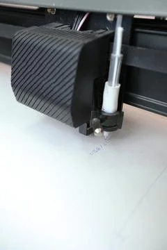 Computerized robot for automatic writing with a pen. Sewing shop. Material ma Stock Photos
