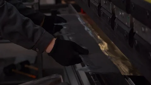 Computerized section of production at plant, worker brings sheets of metal Stock Footage 120066556