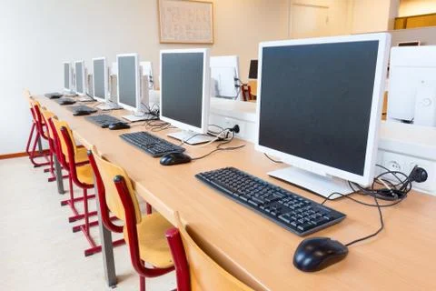 Computers in classroom on high school Stock Photos