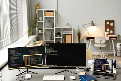 Computers with Code Lines in Office Foto stock