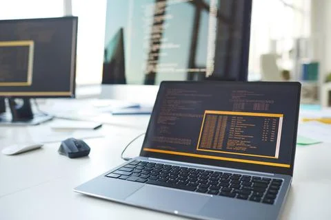 Computers with Code on Screen in IT Programmers Office Stockfoto's