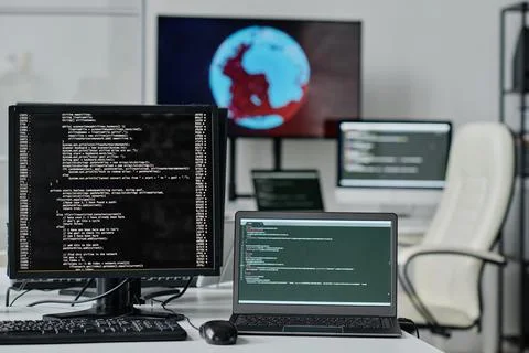 Computers with codes on the screen Stock Photos