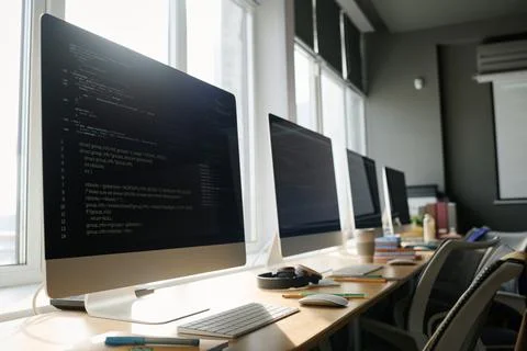 Computers With Codes On Screens In Classroom 写真素材