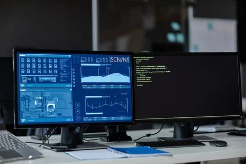 Computers with Data Charts on Screen at Workplace Foto stock