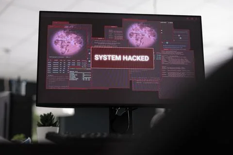 Computers displaying hacked system alert message showing on screen Stockfoto's