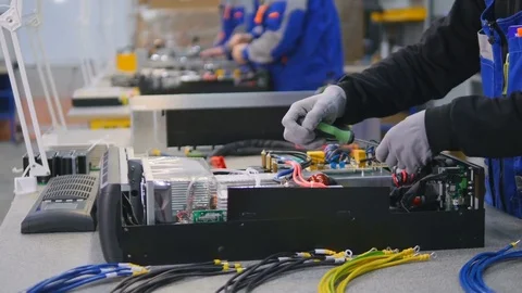 Computers, electric equipment being assembled by factory workers Stock-Footage 73619139