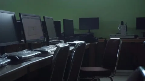 Computers lined up in a dark office room Stock Footage 271145461