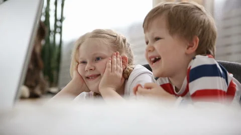 Computers in the lives of modern children. little brother and sister watching Stock-Footage 87149785