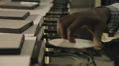 Computers placing cds Stock Footage 30202266