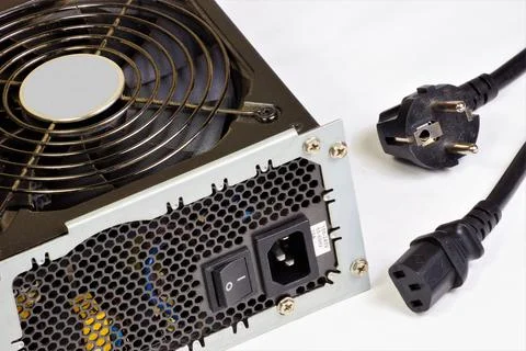 The computer's power supply and network cable. Stock Photos