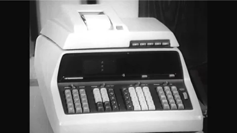 A computing calculator and a magnetic card are shown and an X-Y plotter is used Stock Footage 92631850